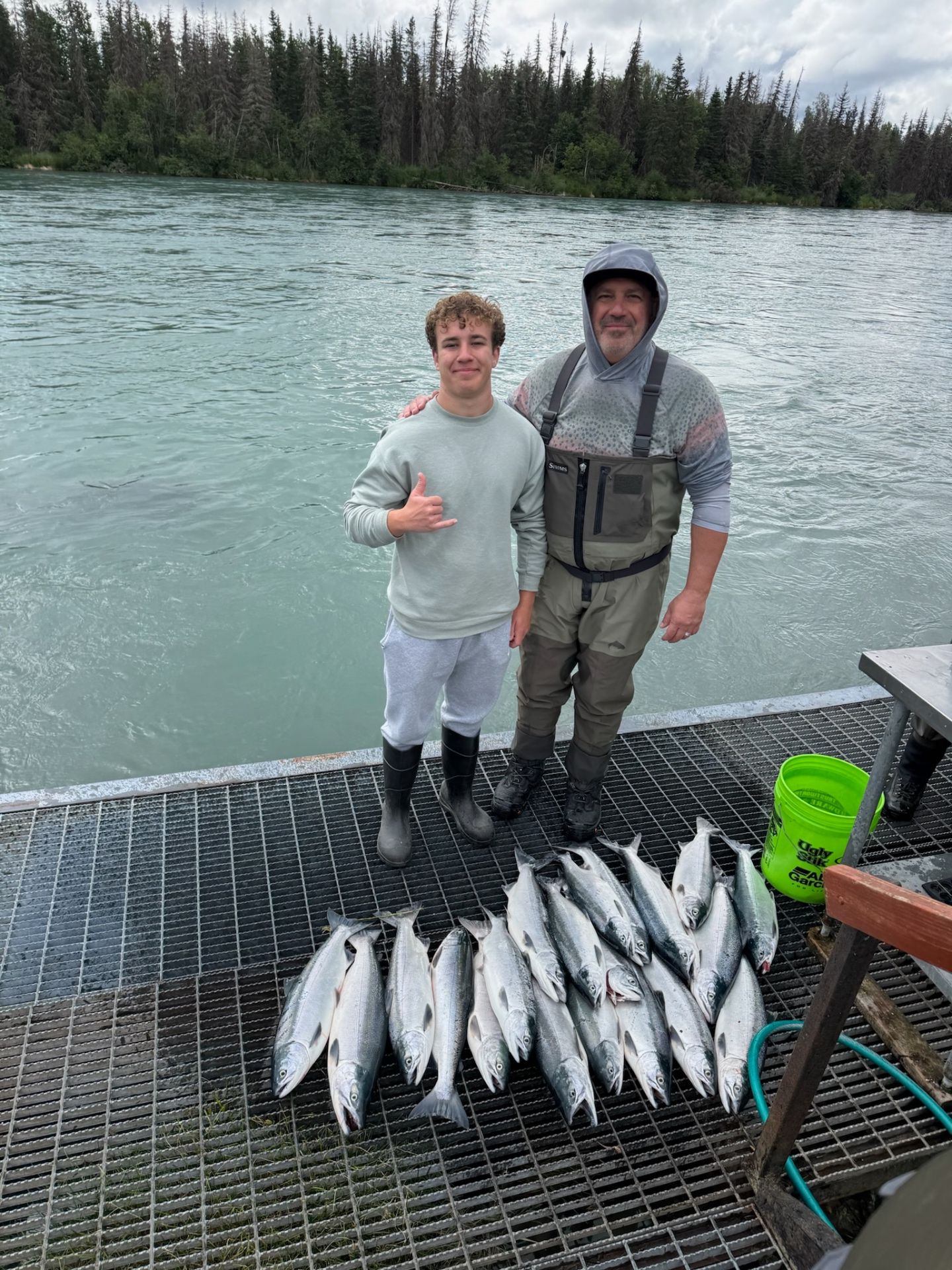 Father and son with their salmon haul