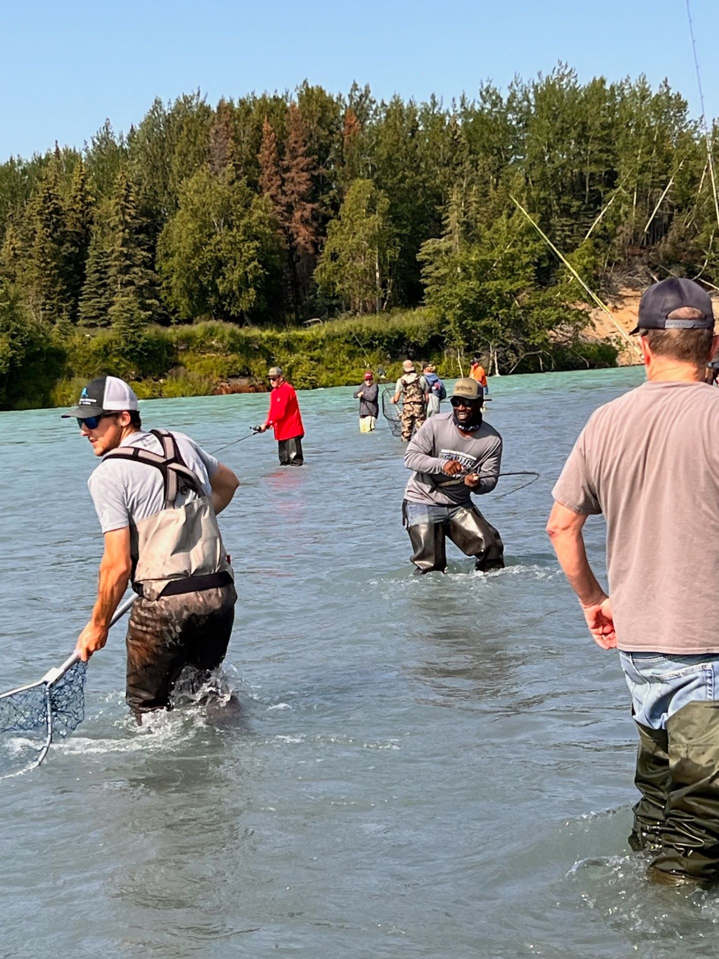 Group of anglers wading and fishing for salmon